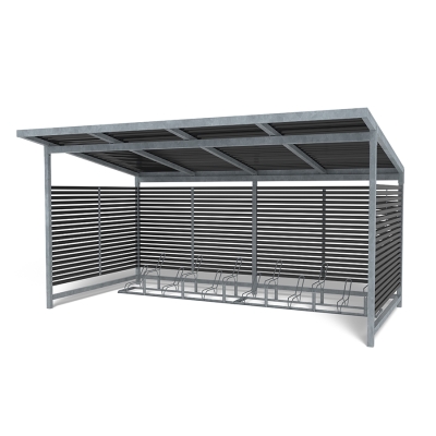 Η στέγη ποδηλάτων Stella με 2 σχάρες ποδηλάτων Gemini προσφέρει μια κομψή, ανθεκτική λύση για εξωτερική αποθήκευση ποδηλάτων. Σχεδιασμένη με μαύρες ξύλινες σανίδες Nordic Pine —με δυνατότητα προσαρμογής σε οποιοδήποτε χρώμα— συμπληρώνει τόσο την κλασική όσο και τη μοντέρνα αρχιτεκτονική. Η στέγη διαθέτει επιλογή από ευθείες ή θολωτές στέγες από κυματοειδές κασσίτερο ή πλαστικό και χωράει έως και 12 ποδήλατα. Σε συνδυασμό με δύο ανεξάρτητες, γαλβανισμένες σχάρες Gemini (η καθεμία χωράει έξι ποδήλατα), αυτή η διάταξη παρέχει ευέλικτο και ασφαλές πάρκινγκ. Εύκολη στην εγκατάσταση και επέκταση με κιτ επέκτασης, είναι ιδανική για σχολεία, επιχειρήσεις και δημόσιους χώρους που αναζητούν μια κομψή, ανθεκτική στις καιρικές συνθήκες και αποδοτική λύση αποθήκευσης ποδηλάτων. Αυτή η παραλλαγή διαθέτει ευθεία σκεπή από κασσίτερο. Οι πόρτες με κλειδαριά είναι προαιρετικές, καθιστώντας τη Stella ιδανική όχι μόνο για αποθήκευση ποδηλάτων, αλλά και ως πάρκο για καροτσάκια ή σταθμό διαλογής απορριμμάτων.